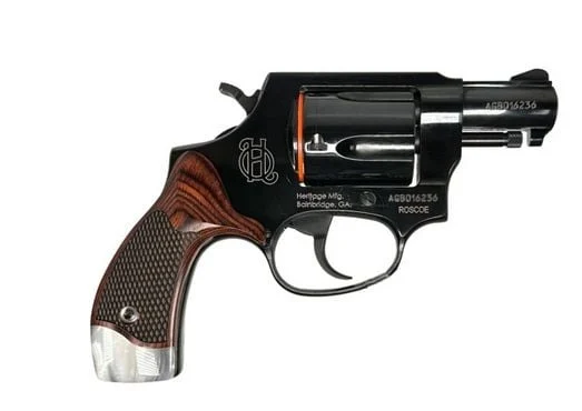 Heritage Roscoe .38 Special revolver with 3" blued barrel and wood grips with pearl inlays