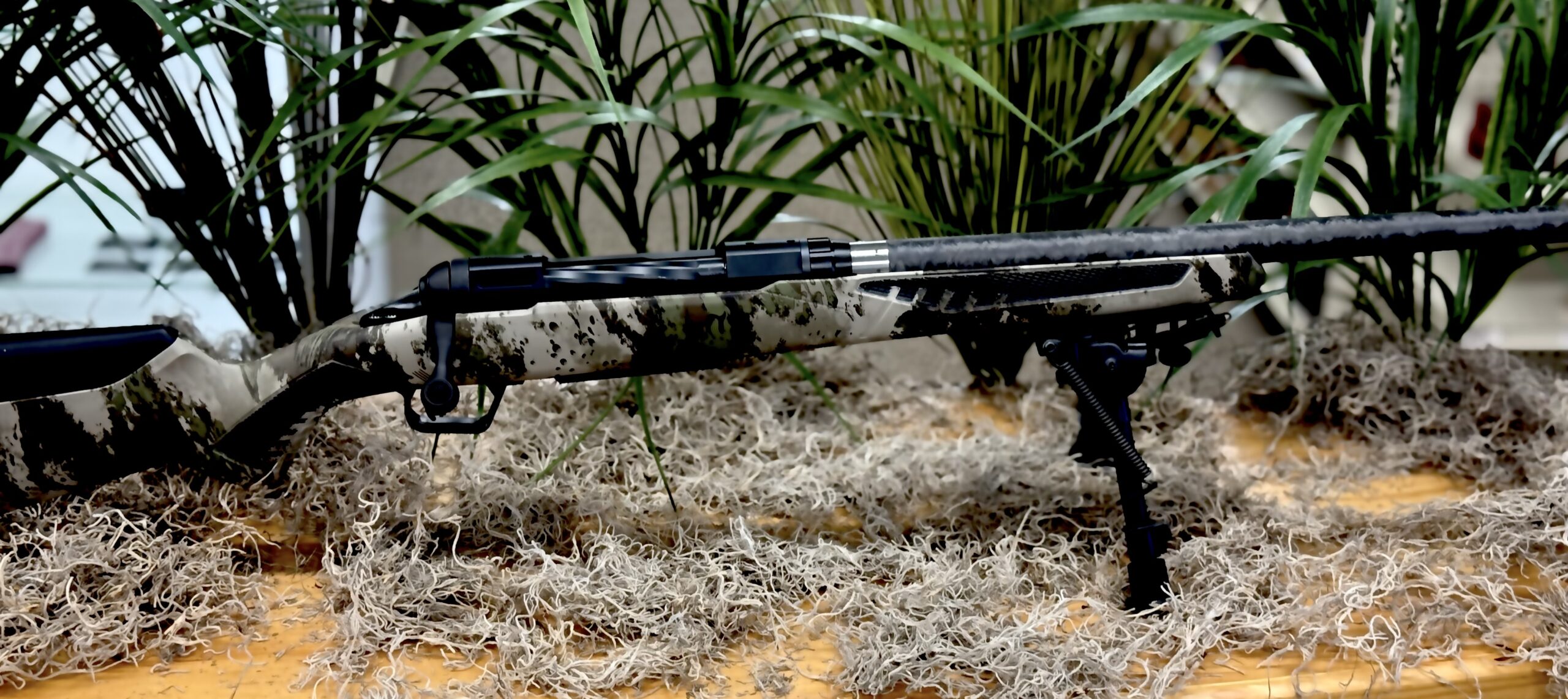 Savage 110 Ultralite 7mm PRC bolt-action rifle with 22" carbon fiber-wrapped threaded barrel and Woodland Camo AccuStock, part number 58029.